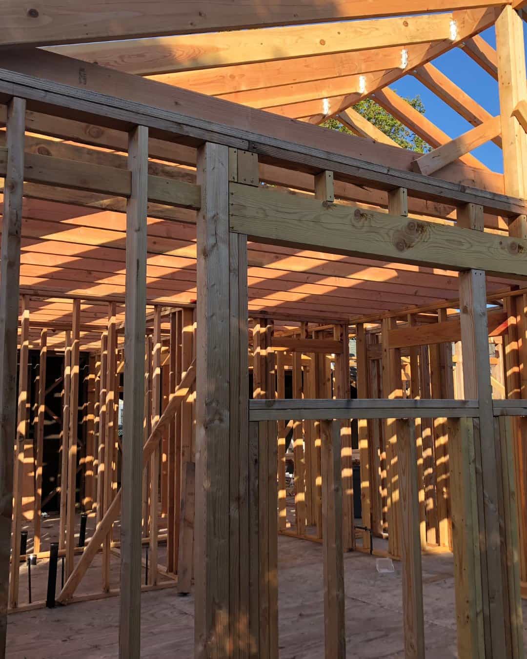 Interior wood framing and exposed roof trusses for a residential home remodeling project in San Carlos, CA.