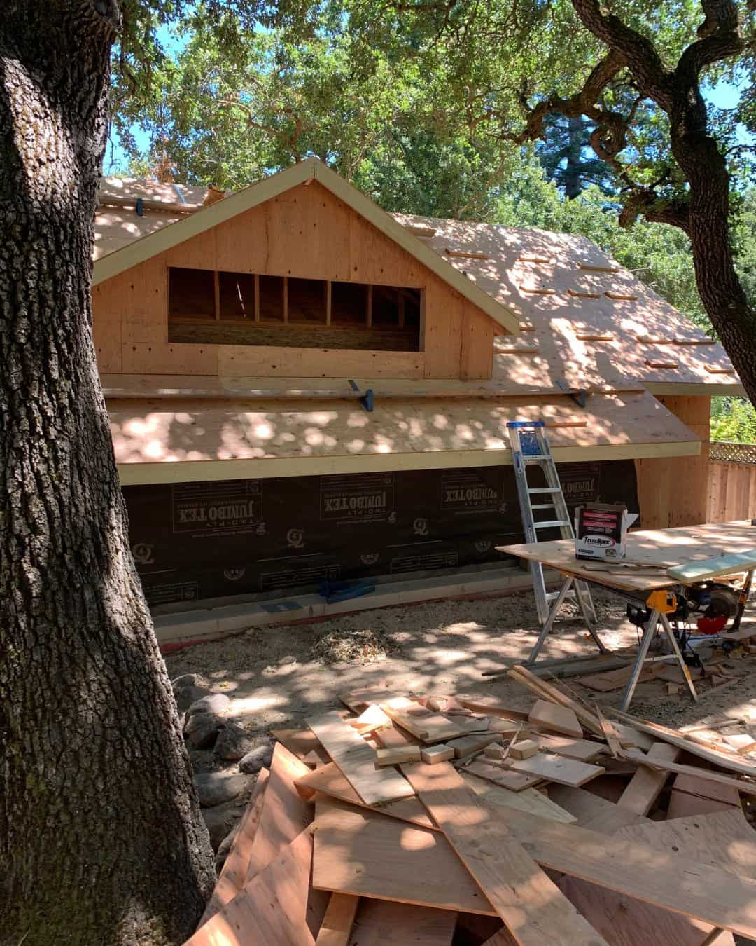 Exterior home addition framing and roof decking in progress for a residential remodeling project in San Carlos, CA.