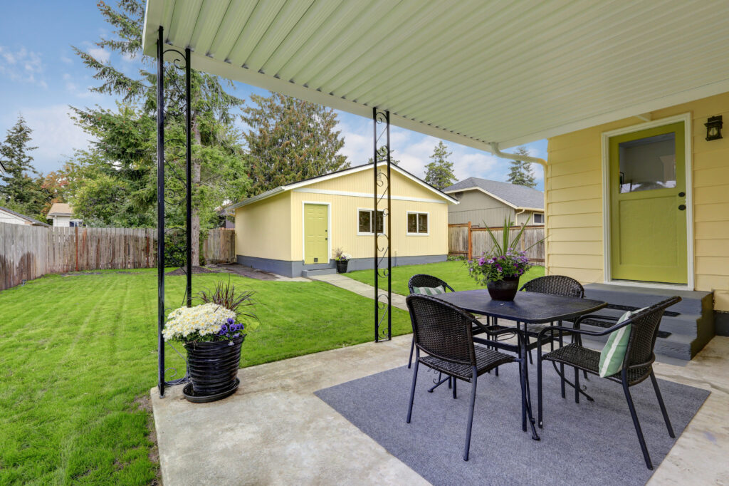Detached ADU guest house in San Mateo County backyard with private entrance and landscaped yard — accessory dwelling unit completed by Genuine Kitchen and Bath in San Carlos