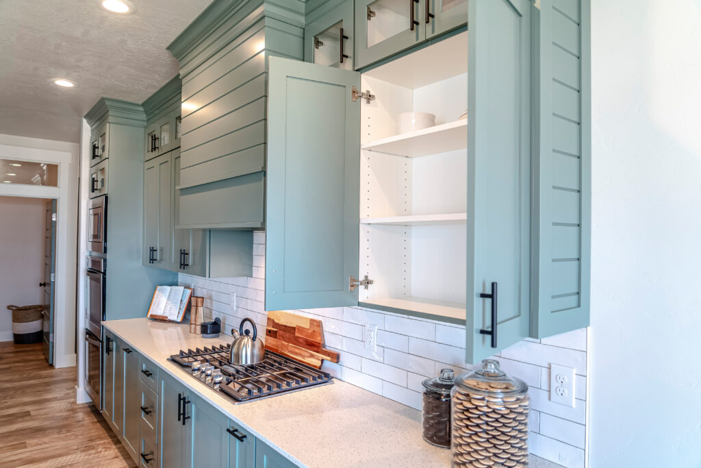 Kitchen cabinet replacement in San Mateo County showing custom shaker cabinet doors open with interior box structure — installed by Genuine Kitchen and Bath in San Carlos